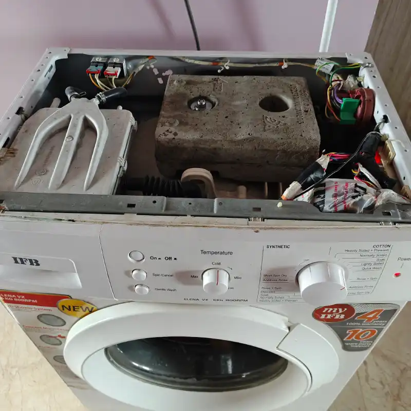 Front-load washing machine opened for repair