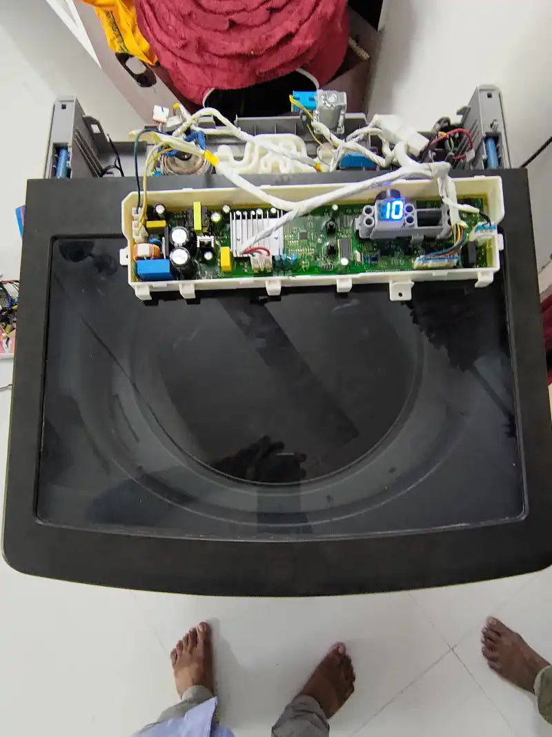 Washing machine control board and wiring under repair